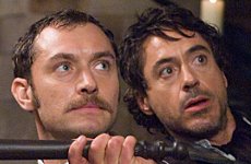 JUDE LAW as Watson and ROBERT DOWNEY JR. as Sherlock Holmes