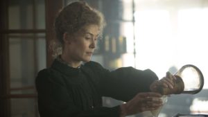 Rosamund Pike as Marie Curie in Radioactive, directed by Marjane Satrapi. Photo: Laurie Sparham. Copyright: StudioCanal. All Rights Reserved.