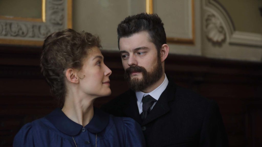 Rosamund Pike as Marie Curie and Sam Riley as Pierre Curie in Radioactive, directed by Marjane Satrapi. Photo: Laurie Sparham. Copyright: StudioCanal. All Rights Reserved.