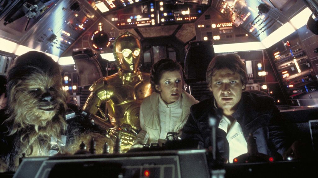 Peter Mayhew as Chewbacca, Anthony Daniels as C-3PO, Carrie Fisher as Princess Leia Organa and Harrison Ford as Han Solo in Star Wars Episode V: The Empire Strikes Back, directed by Irvin Kershner. Photo: Terry Chostner. Copyright: Lucasfilm Ltd. All Rights Reserved.