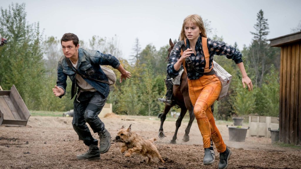 Tom Holland as Todd Hewitt, Manchee the dog and Daisy Ridley as Viola Eade in Chaos Walking, directed by Doug Liman. Photo: Murray Close. Copyright: Lionsgate Films. All Rights Reserved.