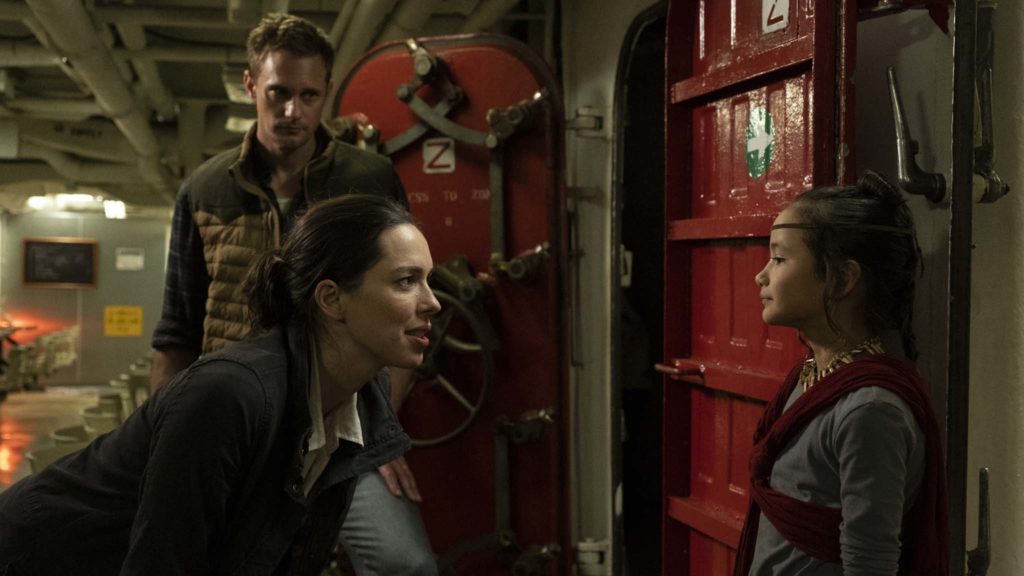 Alexander Skarsgard as Nathan Lind, Rebecca Hall as Ilene Andrews and Kaylee Hottle as Jia in Godzilla Vs Kong, directed by Adam Wingard. Photo: Chuck Zlotnick. Copyright: 2019 Legendary And Warner Bros. Entertainment Inc. Godzilla copyright Toho Co., Ltd. All Rights Reserved.