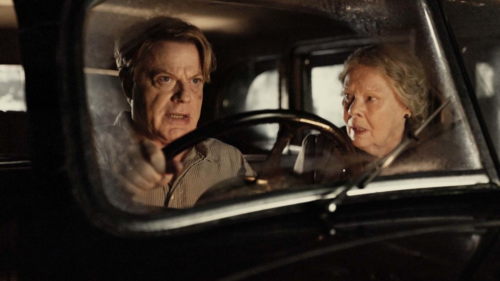 Eddie Izzard as Thomas Miller and Dame Judi Dench as Miss Rocholl in Six Minutes To Midnight, directed by Andy Goddard. Photo: Amanda Searle. Copyright: Reliance Entertainment Productions 6 Ltd. All Rights Reserved.