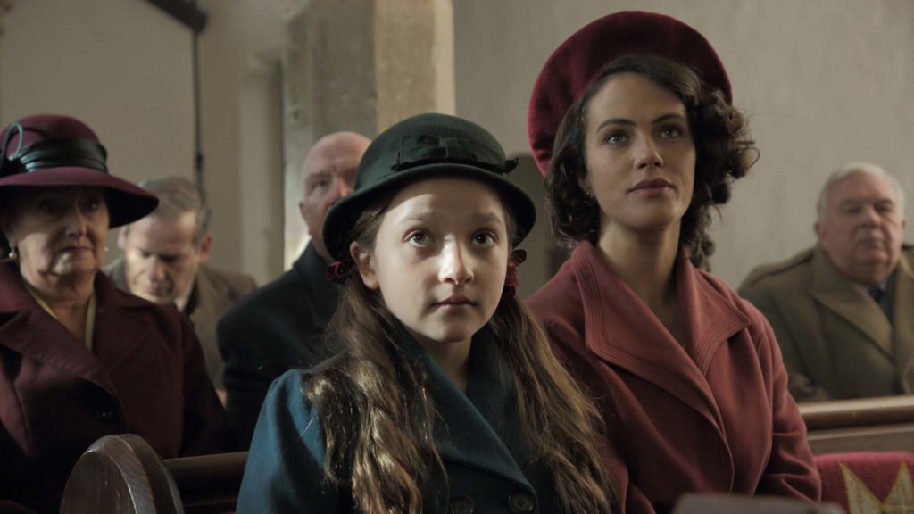 Anya McKenna-Bruce as Adelaide and Jessica Brown Findlay as Marianne in The Banishing, directed by Christopher Smith. Photo: J Tully. Copyright: Vertigo Releasing. All Rights Reserved.