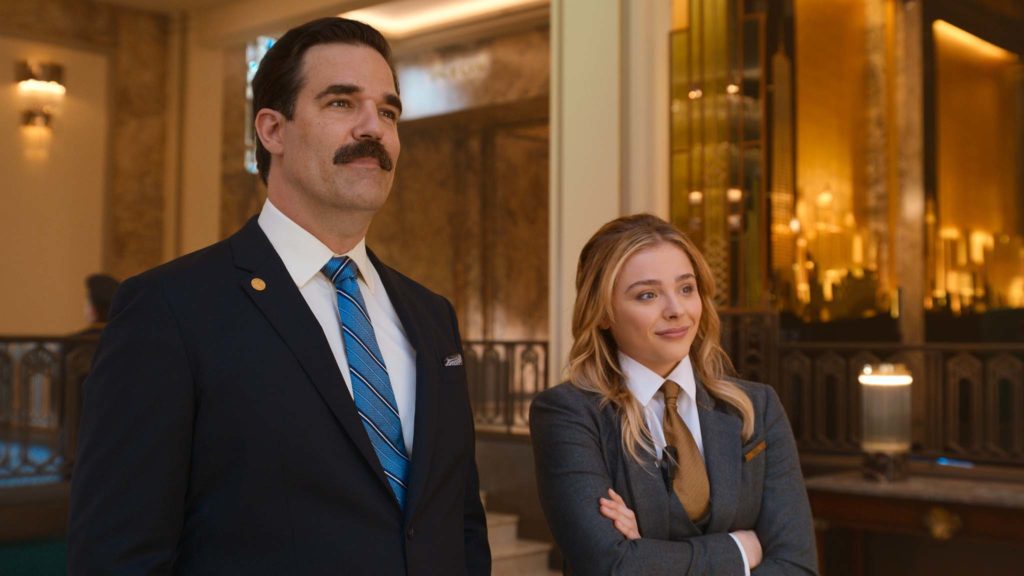 Rob Delaney as Mr Dubros and Chloe Grace Moretz as Kayla in Tom & Jerry The Movie, directed by Tim Story. Photo: courtesy Warner Bros. Pictures. Copyright: 2021 Warner Bros. Entertainment Inc. All Rights Reserved.