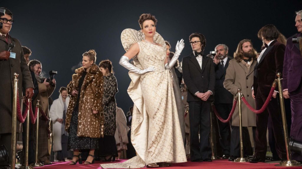 Emma Thompson as the Baroness and Andrew Leung as Jeffrey in Cruella, directed by Craig Gillespie. Photo: Laurie Sparham. Copyright: Disney Enterprises. All Rights Reserved.