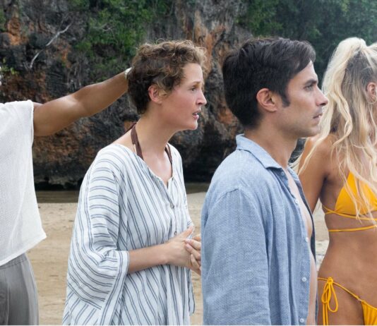 Aaron Pierre as Mid-Sized Sedan, Vicky Krieps as Prisca, Gael García Bernal as Guy and Abbey Lee as Chrystal in Old, directed by M Night Shyamalan. Photo: Phobymo. Copyright: 2021 Universal Studios. All Rights Reserved.