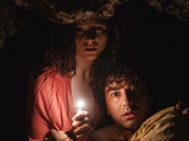 Thomasin McKenzie as Maddox and Alex Wolff as Trent in Old, directed by M Night Shyamalan. Photo: Phobymo. Copyright: 2021 Universal Studios. All Rights Reserved.