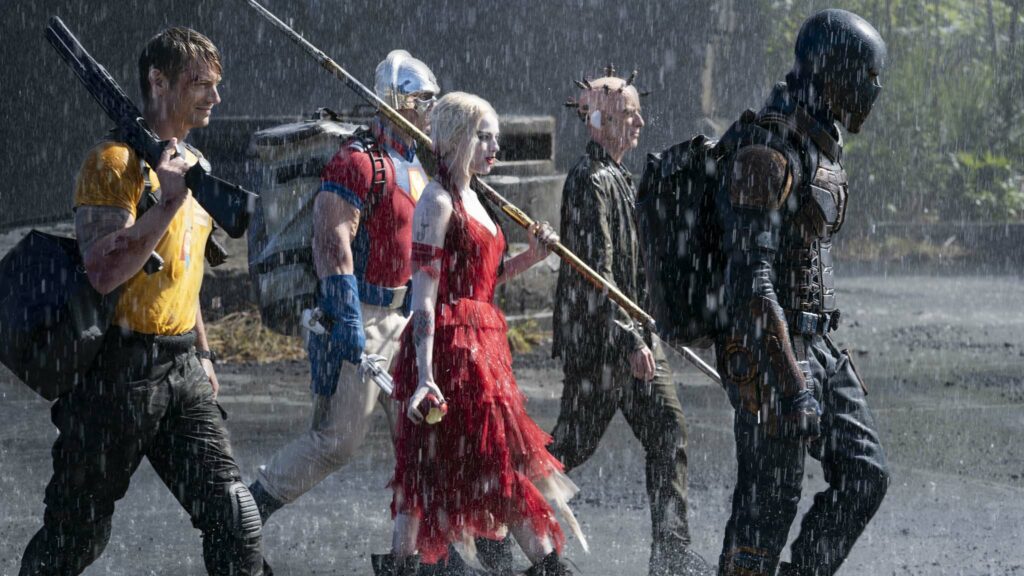 Joel Kinnaman as Rick Flag, John Cena as Peacemaker, Margot Robbie as Harley Quinn, Peter Capaldi as The Thinker and Idris Elba as Bloodsport in The Suicide Squad, directed by James Gunn. Photo: Jessica Miglio. Copyright: 2019 Warner Bros. Entertainment Inc./DC Comics. All Rights Reserved.