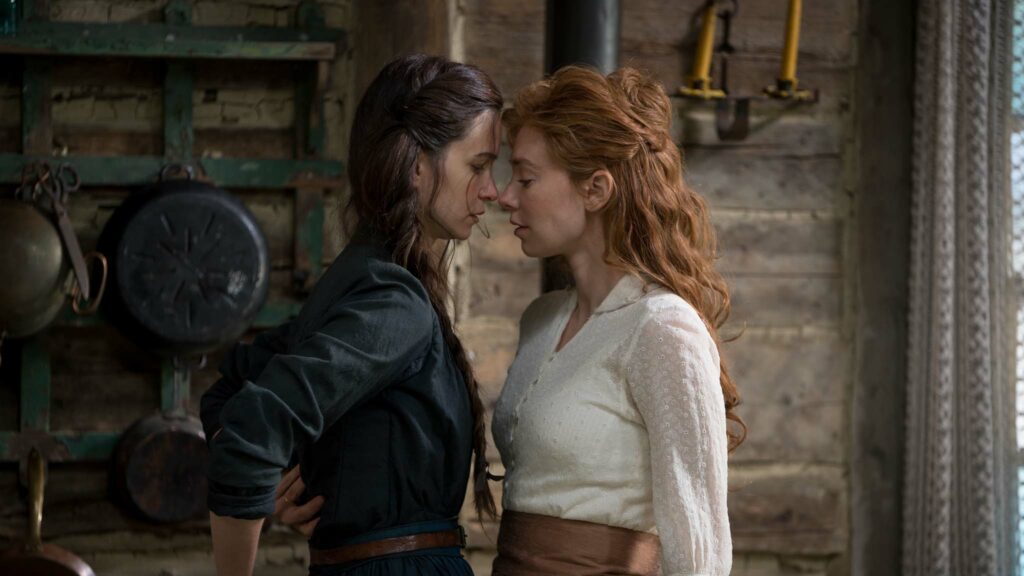 Katherine Waterston as Abigail and Vanessa Kirby as Tallie in The World To Come, directed by Mona Fastvold. Photo: Vlad Cioplea. Copyright: 2021 CTMG, Inc. All Rights Reserved.