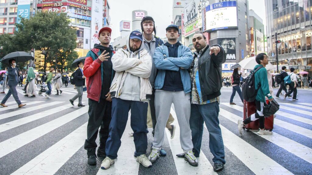 Dan Sylvester as Decoy, Hugo Chegwin as DJ Beats, Steve Stamp as Steves, Allan Mustafa as MC Grindah and Asim Chaudhry as Chabuddy G in People Just Do Nothing: Big In Japan, directed by Jack Clough. Copyright: Universal Pictures. All Rights Reserved.