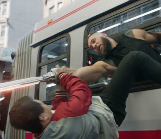 Simu Liu as Shang-Chi and Florian Munteanu as Razor Fist in Shang-Chi And The Legend Of The Ten Rings, directed by Destin Daniel Cretton. Copyright: 2021 Marvel Studios. All Rights Reserved.