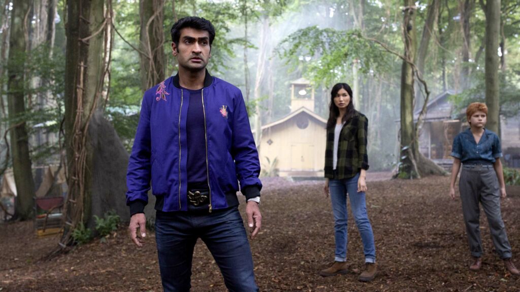 Kumail Nanjiani as Kingo, Gemma Chan as Sersi and Lia McHugh as Sprite in Marvel Studios' Eternals, directed by Chloe Zhao. Photo: Sophie Mutevelian. Copyright: 2021 Marvel Studios. All Rights Reserved.