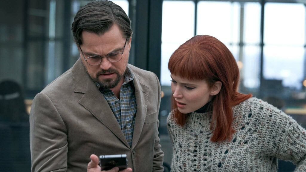 Leonardo DiCaprio as Dr Randall Mindy and Jennifer Lawrence as Kate Dibiasky in Don't Look Up, directed by Adam McKay. Photo: Niko Tavernise. Copyright: 2021 Netflix, Inc. All Rights Reserved.