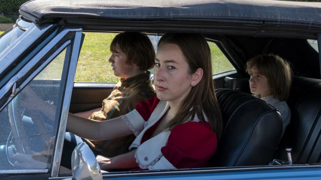 Cooper Hoffman as Gary Valentine, Alana Haim as Alana Kane and Milo Herschlag as Greg in Licorice Pizza, directed by Paul Thomas Anderson. Photo: Melinda Sue Gordon. Copyright: 2021 Metro-Goldwyn-Mayer Pictures Inc. All Rights Reserved.
