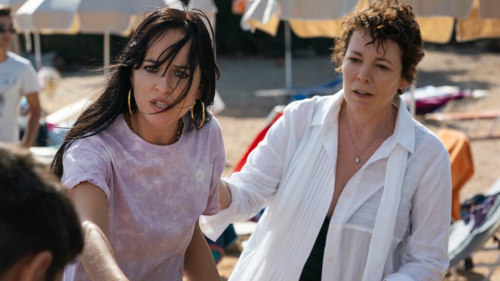 Dakota Johnson as Nina and Olivia Colman as Leda in The Lost Daughter, directed by Maggie Gyllenhaal. Photo: Yannis Drakoulidis. Copyright: 2021 Netflix. All Rights Reserved.