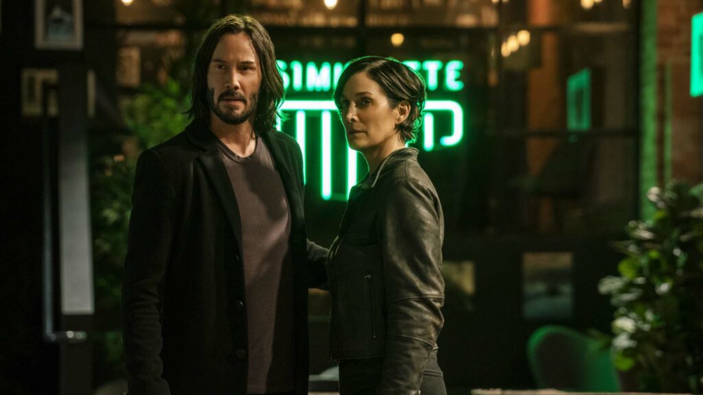 Keanu Reeves as Neo/Thomas Anderson and Carrie-Anne Moss as Trinity in The Matrix Resurrections, directed by Lana Wachowski. Photo: Murray Close. Copyright: 2021 Warner Bros. Entertainment Inc./Village Roadshow Films (BVI) Limited. All Rights Reserved.