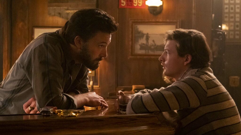 Ben Affleck as Charlie Moehringer and Tye Sheridan as JR Moehringer in The Tender Bar, directed by George Clooney. Photo: Claire Folger. Copyright: Amazon Content Services LLC. All Rights Reserved.