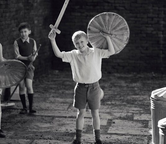 Jude Hill as Buddy in Belfast, directed by Kenneth Branagh. Photo: Rob Youngson. Copyright: 2021 Focus Features, LLC. All Rights Reserved.