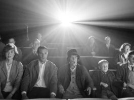 Caitriona Balfe as Ma, Jamie Dornan as Pa, Dame Judi Dench as Granny, Jude Hill as Buddy and Lewis McAskie as Will in Belfast, directed by Kenneth Branagh. Photo: Rob Youngson. Copyright: 2021 Focus Features, LLC. All Rights Reserved.