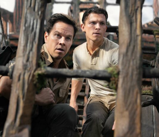 Mark Wahlberg as Victor “Sully” Sullivan and Tom Holland as Nathan Drake in Uncharted, directed by Ruben Fleischer. Photo: Clay Enos. Copyright: 2021 CTMG, Inc. All Rights Reserved.