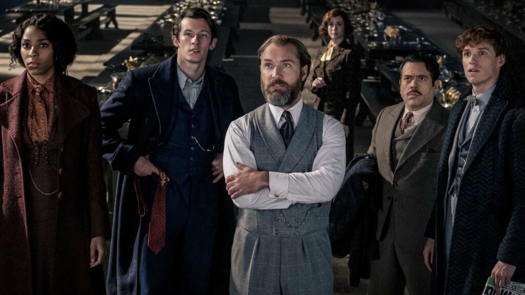 Jessica Williams as Eulalie “Lally” Hicks, Callum Turner as Theseus Scamander, Jude Law as Albus Dumbledore, Fionna Glascott as Minerva McGonagall, Dan Fogler as Jacob Kowalski and Eddie Redmayne as Newt Scamander in Fantastic Beasts: The Secrets Of Dumbledore, directed by David Yates. Photo: Jaap Buitendijk. Copyright: 2022 Warner Bros. Entertainment Inc. All Rights Reserved.