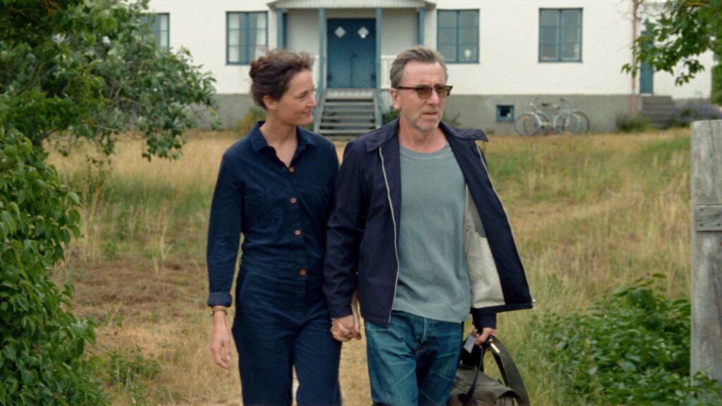 Vicky Krieps as Chris and Tim Roth as Tony in Bergman Island, directed by Mia Hansen-Love. Copyright: MUBI. All Rights Reserved.