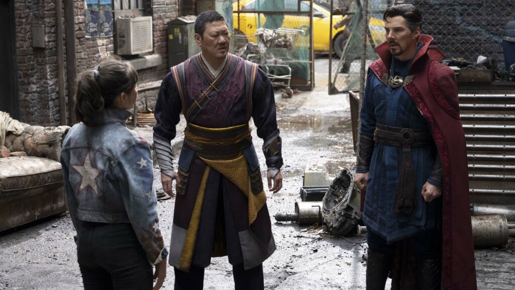 Xochitl Gomez as America Chavez, Benedict Wong as Wong, and Benedict Cumberbatch as Doctor Strange/Stephen Strange in Doctor Strange In The Multiverse Of Madness, directed by Sam Raimi. Photo: Jay Maidment. Copyright: 2022 Marvel Studios. All Rights Reserved.