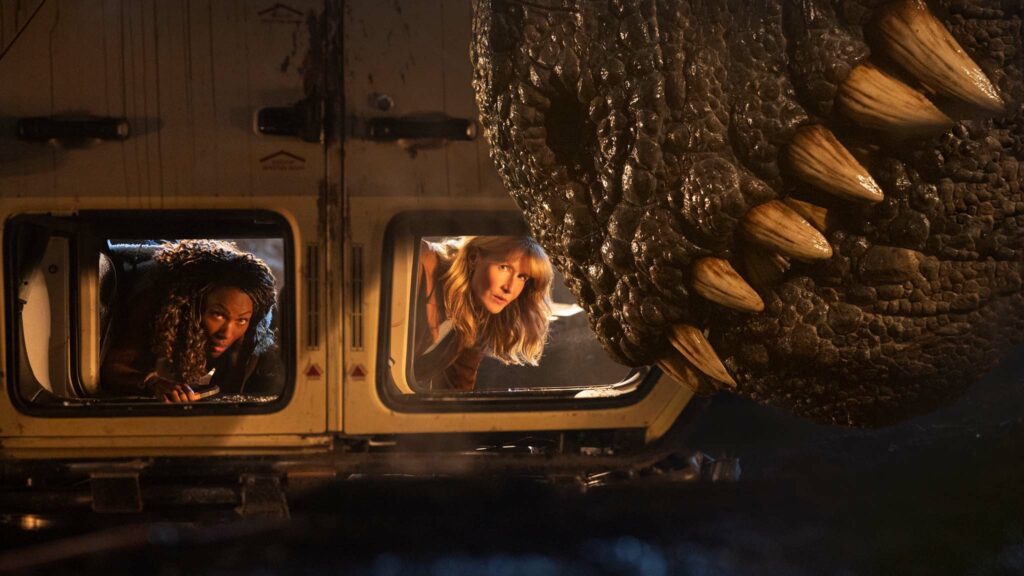 DeWanda Wise as Kayla Watts, Laura Dern as Dr Ellie Sattler and a Giganotosaurus in Jurassic World: Dominion, directed by Colin Trevorrow. Photo: John Wilson. Copyright: 2022 Universal Studios and Amblin Entertainment. All Rights Reserved.