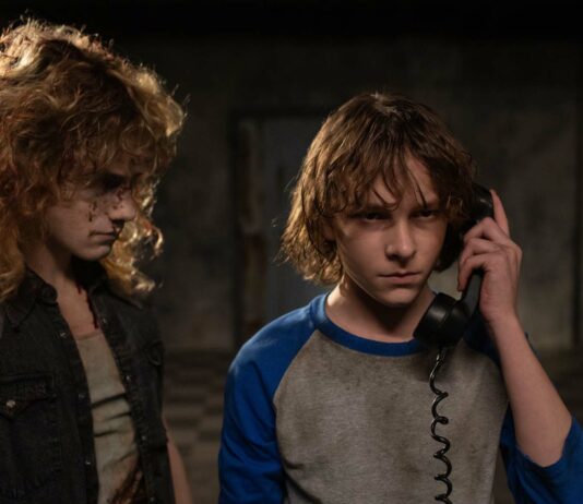 Brady Hepner as Vance Hopper and Mason Thames as Finney Shaw in The Black Phone, directed by Scott Derrickson. Photo: Fred Norris. Copyright: 2022 Universal Studios. All Rights Reserved.