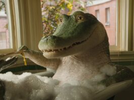 Lyle (voiced by Shawn Mendes) takes a bath in Lyle, Lyle, Crocodile. Copyright: CTMG, Inc. All Rights Reserved.