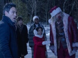 Alex Hassell as Jason, Beverly D’Angelo as Gertrude, Edi Patterson as Alva, Alexis Louder as Linda, Leah Brady as Trudy and David Harbour as Santa in Violent Night, directed by Tommy Wirkola. Photo: Allen Fraser. Copyright: 2022 Universal Studios. All Rights Reserved.