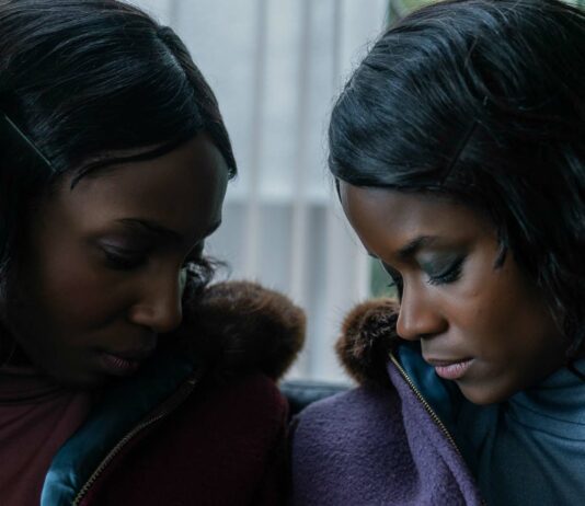 Tamara Lawrance as Jennifer Gibbons and Letitia Wright as June Gibbons in The Silent Twins, directed by Agnieszka Smoczynska. Photo: Lukasz Bak. Copyright: 2022 Focus Features, LLC. All Rights Reserved.