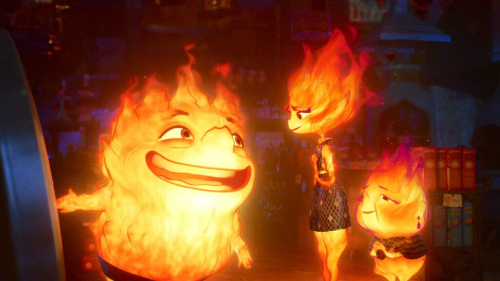 Bernie Lumen (voiced by Ronnie del Carmen), Ember Lumen (Leah Lewis) and Cinder Lumen (Shila Ommi) in Elemental, directed by Peter Sohn. Copyright: Disney/Pixar. All Rights Reserved.