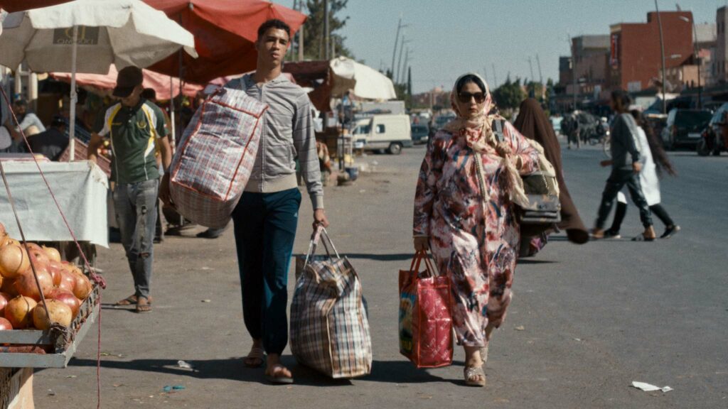 Abdellah El Hajjouji as Selim and Aicha Tebbae as Fatima-Zahra in The Damned Don’t Cry, directed by Fyzal Boulifa. Copyright: Curzon Artificial Eye. All Rights Reserved.