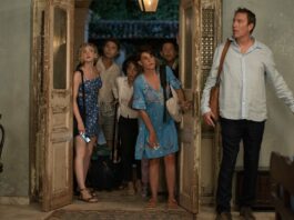 Elena Kampouris as Paris, Elias Kacavas as Aristotle, Andrea Martin as Aunt Voula, Nia Vardalos as Toula, Louis Mandylor as Nick and John Corbett as Ian in My Big Fat Greek Wedding 3, directed by Nia Vardalos. Photo: Yannis Drakoulidis. Copyright: Focus Features, LLC. All Rights Reserved.