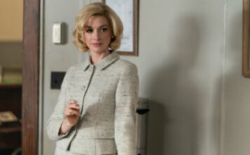 Anne Hathaway as Dr Rebecca St John in Eileen, directed by William Oldroyd. Photo: Jeong Park. Copyright: Universal Pictures. All Rights Reserved.