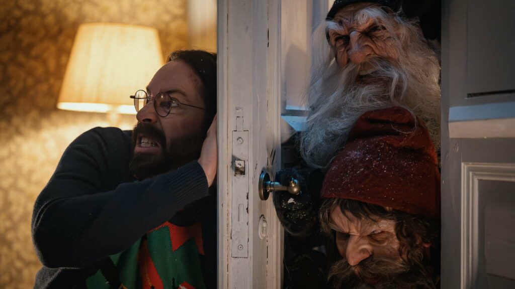 Martin Starr as Bill faces angry barn elves in There’s Something In The Barn, directed by Magnus Martens. Photo: Salna Lukas. Copyright: Vertigo Films. All Rights Reserved.