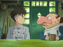 Mahito Maki (voiced by Soma Santoki) and The Grey Heron (Masaki Suda) in The Boy And The Heron, directed by Hayao Miyazaki. Copyright: Studio Ghibli/Elysian. All Rights Reserved.