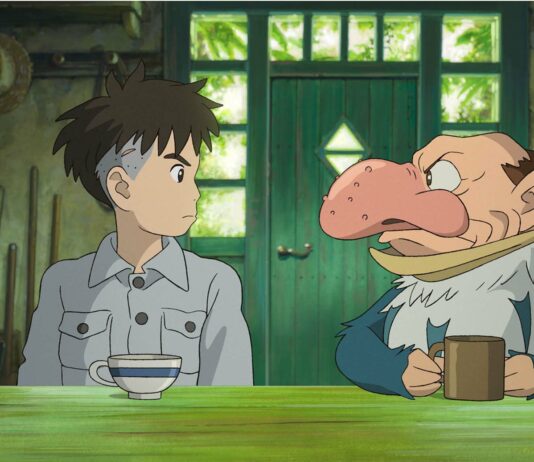 Mahito Maki (voiced by Soma Santoki) and The Grey Heron (Masaki Suda) in The Boy And The Heron, directed by Hayao Miyazaki. Copyright: Studio Ghibli/Elysian. All Rights Reserved.