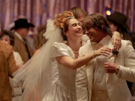 Lily James as Pam Adkisson and Zac Efron as Kevin Von Erich in The Iron Claw, directed by Sean Durkin. Photo: Brian Roedel. Copyright: House Claw LLC. All Rights Reserved.