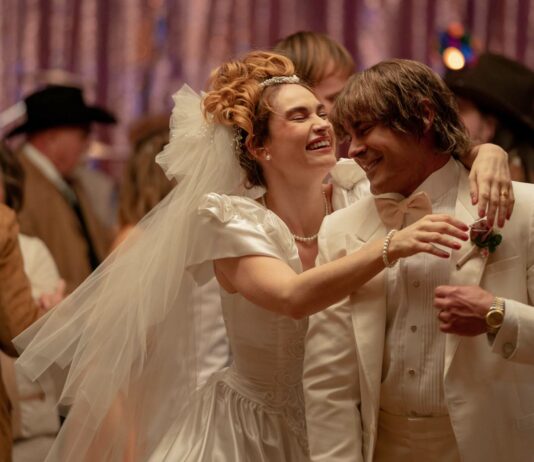 Lily James as Pam Adkisson and Zac Efron as Kevin Von Erich in The Iron Claw, directed by Sean Durkin. Photo: Brian Roedel. Copyright: House Claw LLC. All Rights Reserved.