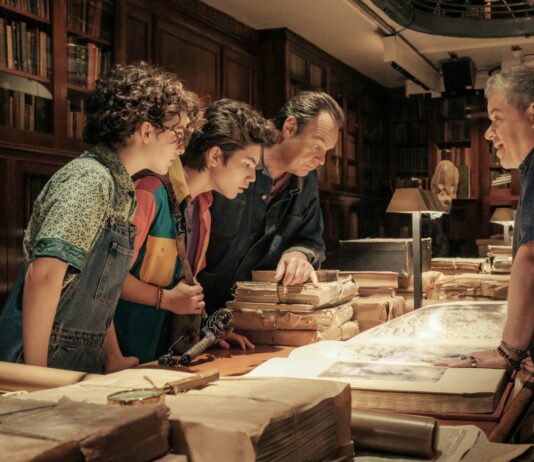 Mckenna Grace as Phoebe, Logan Kim as Podcast, Dan Aykroyd as Ray and Patton Oswalt as Dr Hubert Wartzki in Ghostbusters: Frozen Empire, directed by Gil Kenan. Photo: Jaap Buitendijk. Copyright: CTMG, Inc. All Rights Reserved.