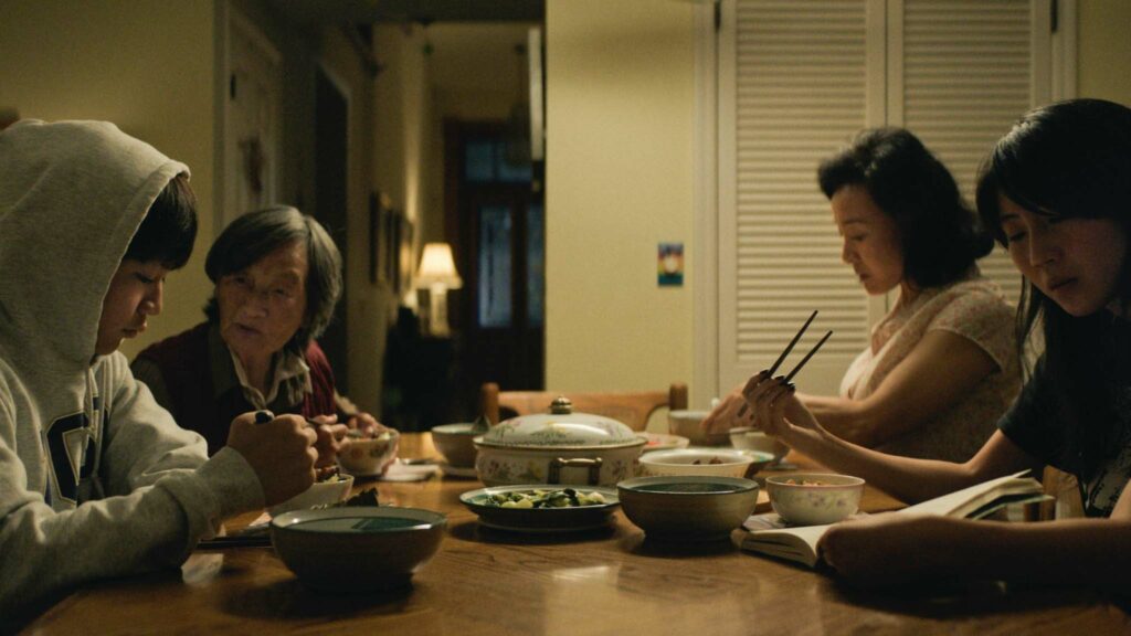 Izaac Wang as Chris Wang, Chang Li Hua as Nai Nai, Joan Chen as Chungsing Wang and Shirley Chen as Vivian Wang in Didi, directed by Sean Wang. Copyright: Focus Features/Talking Fish Pictures. All Rights Reserved.