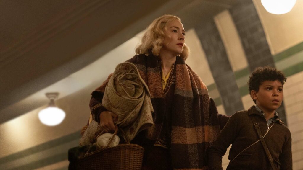Saoirse Ronan as Rita and Elliott Heffernan as George in Blitz, directed by Steve McQueen. Photo: Parisa Taghizadeh. Copyright: Apple TV+. All Rights Reserved.