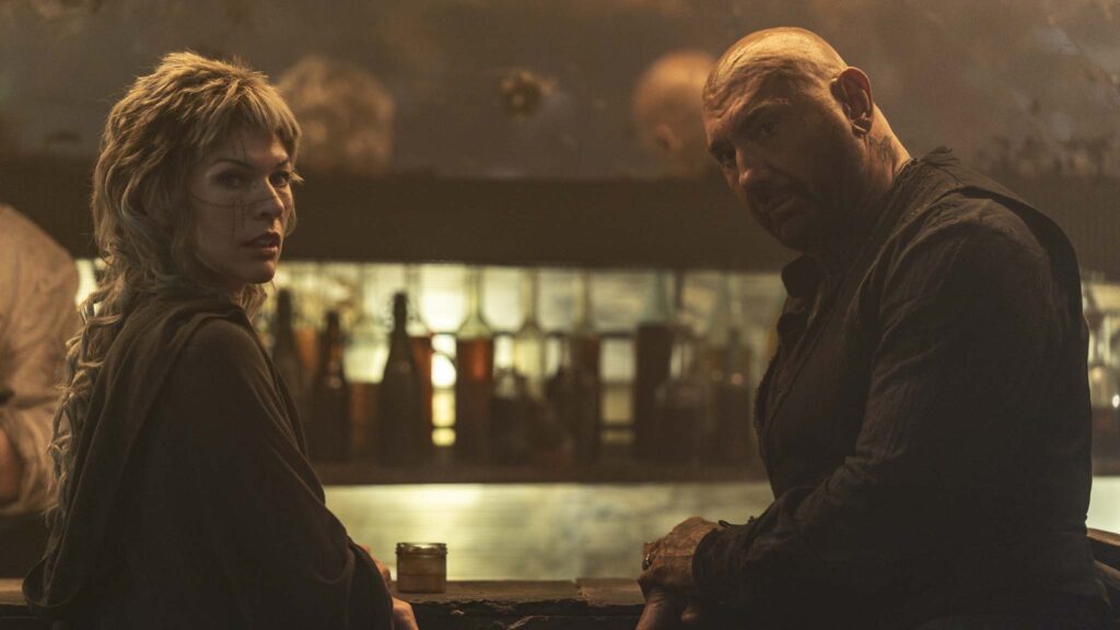 Milla Jovovich as Gray Alys and Dave Bautista as Boyce in In The Lost Lands, directed by Paul WS Anderson. Photo: Krzysztof Wiktor. Copyright: StudioCanal. All Rights Reserved.