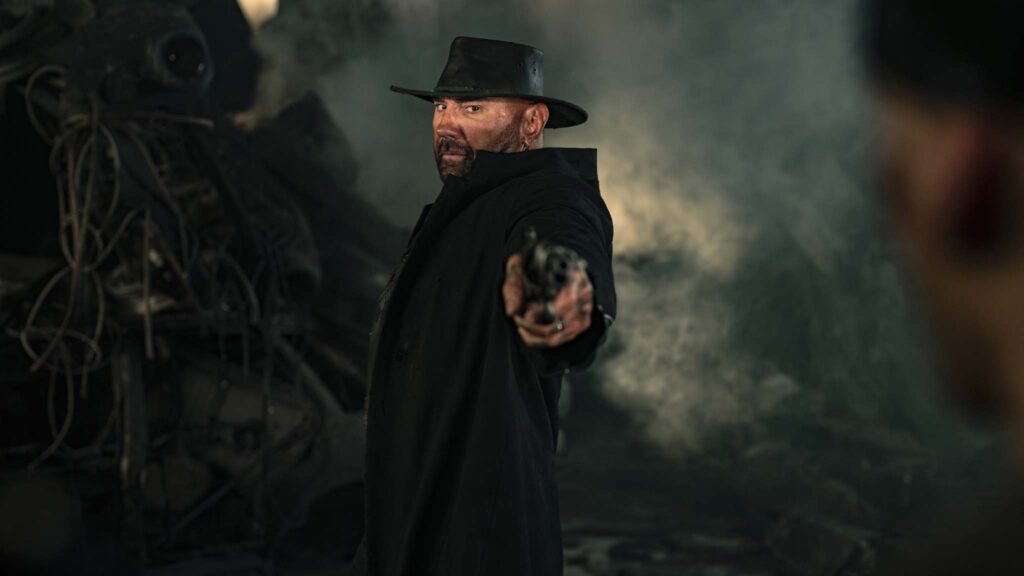 Milla Jovovich as Gray Alys and Dave Bautista as Boyce in In The Lost Lands, directed by Paul WS Anderson. Photo: Krzysztof Wiktor. Copyright: StudioCanal. All Rights Reserved.