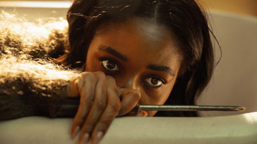 Ayo Edebiri as Ariel Ecton in Opus, directed by Mark Anthony Green. Photo: Anna Kooris. Copyright: Warner Bros. Entertainment/Caesars Request, LLC. All Rights Reserved.