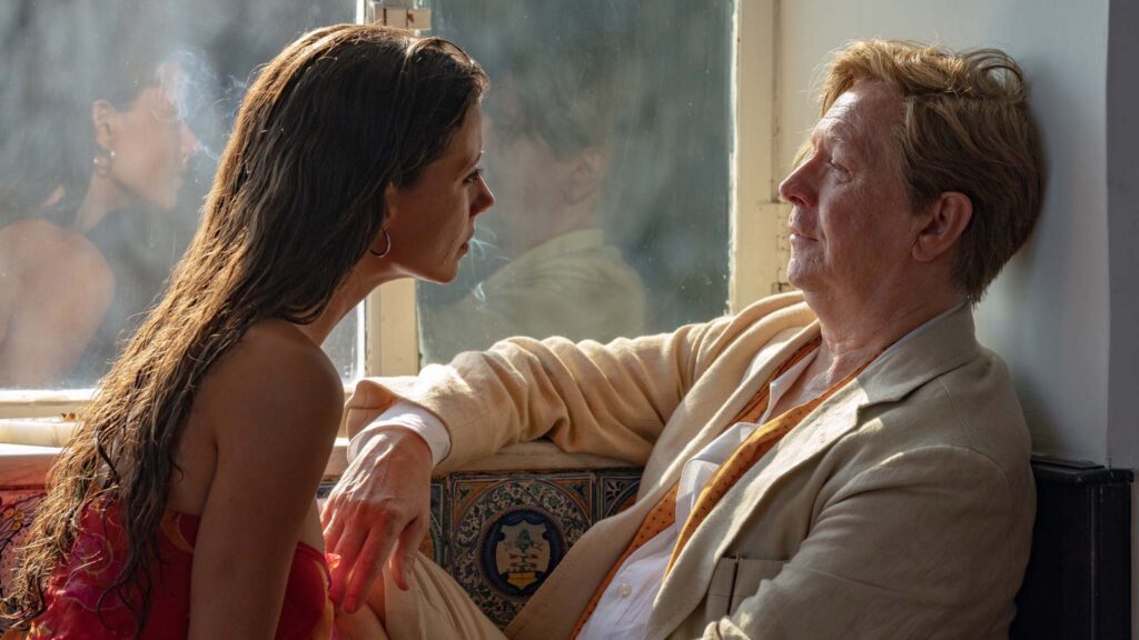 Celeste Dalla Porta as Parthenope and Gary Oldman as John Cheever in Parthenope, directed by Paolo Sorrentino. Photo: Gianni Fiorito. Copyright: Picturehouse Entertainment. All Rights Reserved.