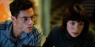 Rami Malek as Heller and Caitriona Balfe as Inquiline in The Amateur, directed by James Hawes. Photo: John Wilson. Copyright: 20th Century Studios. All Rights Reserved.